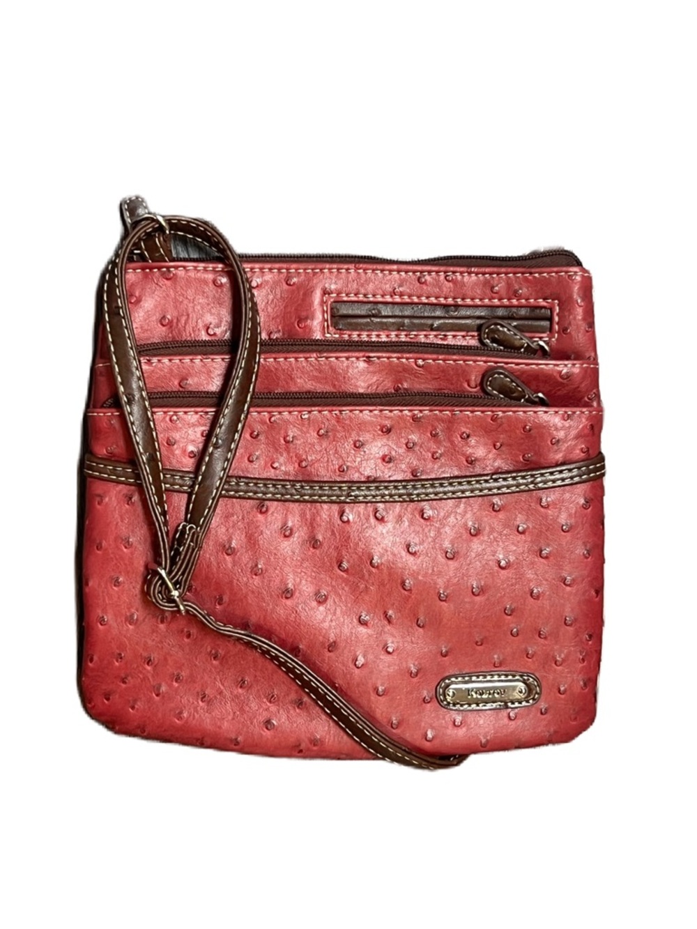 Koltov red crossbody bag, featuring pebbled texture, multiple zippered pockets